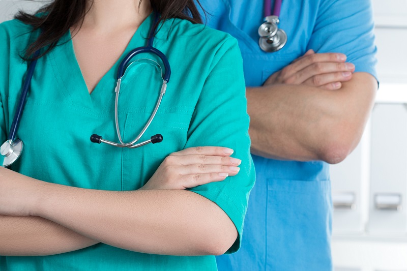 Two doctors with crossed arms